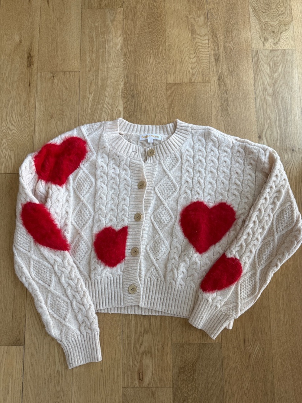 Cream Cable-Knit Cardigan with Red Heart Details